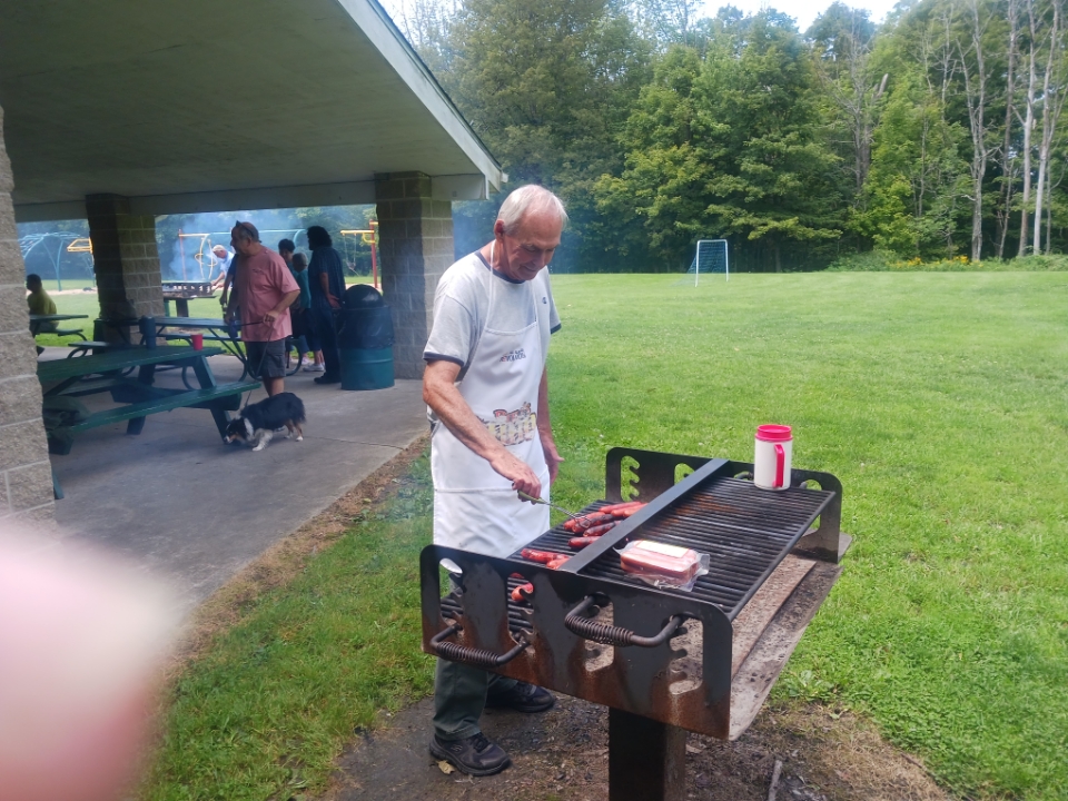 church picnic 2023 man grilling at park